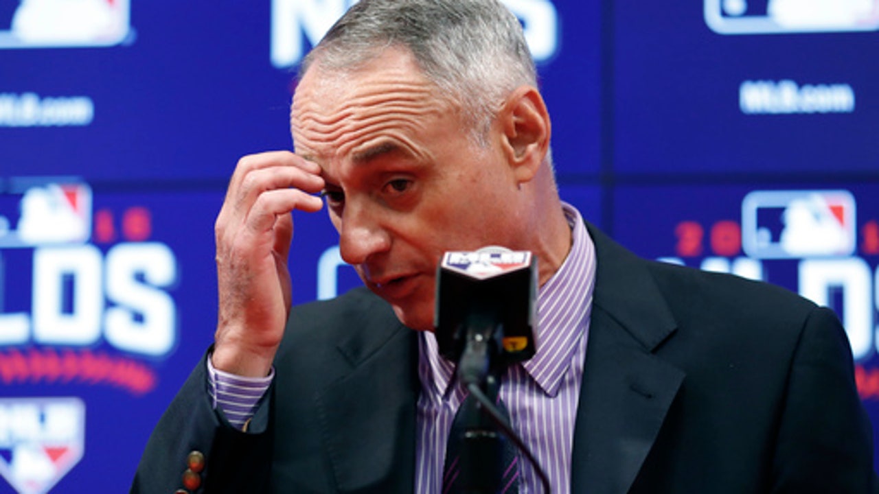 MLB head Manfred confident no more can-throwing in Toronto